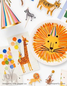 children's party decorations including paper plates, zebras and giraffes