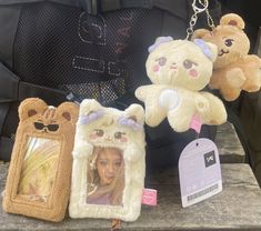 teddy bears are on display in the back seat of a car with tags attached to them