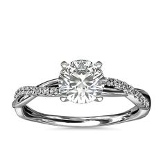 a white gold engagement ring with diamonds on it