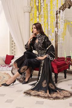 SHIRT STYLE: Mock neck long front open Shirt FABRIC: Gold Zari Front fully embroidered, Embellished neckline of shirt with embroidered sleeves and back. Color: Black TROUSER Embellished Silk Grip Trouser Color: Black DUPATTA Embellished Organza Dupatta Luxury Suit, Black Dupatta, Chiffon Suit, Open Shirt, Embellished Neckline, Printed Dupatta, Embroidered Sleeves, Embroidered Chiffon, Organza Dupatta