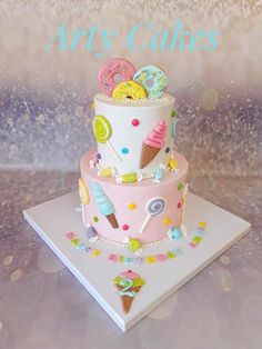 a birthday cake with ice cream, donuts, and sprinkles on it