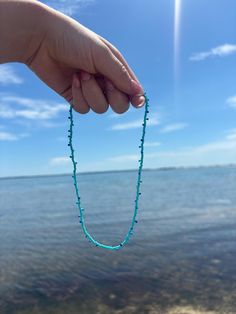 Necklace made of various shades of blue that's perfect for accessorizing any outfit! This necklace was handmade with seed beads. Blue Heishi Beads Bracelet With Tiny Beads, Blue Beaded Necklaces For Jewelry Making In Summer, Blue Tiny Beads Beaded Bracelets For Beach, Light Blue Beaded Necklaces For The Beach, Summer Turquoise Beaded Necklaces With Colorful Beads, Light Blue Beaded Necklace For The Beach, Light Blue Beaded Necklace For Beach, Blue Polished Bead Necklaces For Beach, Turquoise Beaded Necklace With Large Beads For Summer