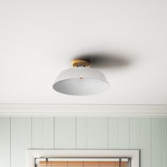 a bathroom with green walls and white trim on the ceiling is pictured in this image