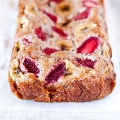 a loaf of fruit bread sitting on top of a table