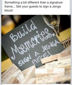 a pile of wine corks sitting on top of a table next to a sign