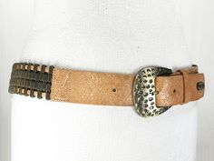 "Measures end to end 34''/86 cm to the first hole - 26''/66 cm To the last hole - 30\"/76 cm wide 1.2''/3 cm Very good condition Belt feels heavy because of metal decorations. This brown waist belt is perfect for adding to your both vintage and everyday outfits. This belt with a antique metal buckle will fit you for any circumstance: you are on the date? Or a family dinner? Or even Memorial weekend celebration? Even disco party! This unique belt will make you look perfect and featured. You can b Vintage Adjustable Metal Belt, Adjustable Corset Belt With Belt Loops For Festivals, Adjustable Corset Belt For Festivals, Adjustable Bohemian Belt With Antique Buckle, Bohemian Adjustable Belt With Antique Buckle, Adjustable Vintage Corset Belt, Adjustable Vintage Corset Belt With Removable Feature, Vintage Belts With Antique Buckle, Adjustable, Brown Waist Belt