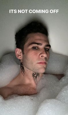 a man in a bubble bath with the caption it's not coming off