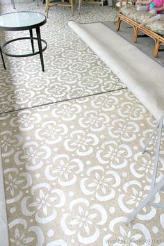 a living room filled with lots of furniture and decor on top of carpeted flooring