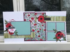 a close up of a window sill with flowers on the windowsill and an empty card