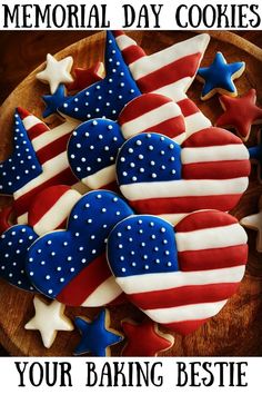 patriotic cookies decorated with stars and stripes on a wooden platter that says memorial day cookies your baking bestie