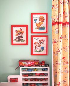 a child's room with pictures on the wall