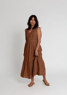 The Priscilla Dress offers a timeless look featuring a midi length and sleeveless design. Its organic cotton composition offers superior breathability and a soft feel against the skin, while its relaxed fit complements any style. Organic Cotton Dress, Apparel Brand, Sustainable Clothing, The Skin, Spring Dresses, Casual Fits, Cotton Dress, Cotton Dresses, Midi Length