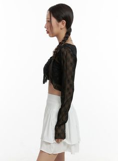 Product Detail Style : Romantic, Feminine Occasion : Festival Detail : Ribbon, Pearl, See-through Material : Spandex, Nylon Sleeve : Long sleeve Length : Crop Nylon 90 Spandex 10 Color : Black, Light beige Made in Korea Model Size Model is wearing size S/M and the color Black. Height : 5'5" | 166cm / Top : S / Bottom : S (25 inch) .prddescription table, .prddescription td, .prddescription th { border : 1px solid black; border-collapse : collapse; padding: 10px; } Size(Inch) Size Shoulder Bust Sl Casual Fitted Blouse With Mesh Sleeves, Black High Stretch Mesh Top For Spring, Chic Sheer Long Sleeve Cardigan, Stretch Crop Top With Sheer Long Sleeves, Fitted Long Sleeve Crop Top With Sheer Sleeves, Black Fitted Cardigan For Spring, Black Fitted Long Sleeve Mesh Top, Fitted Black Cardigan, Festival Crop Tops