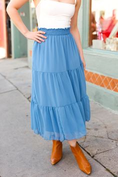 Made for any occasion, this midi skirt with a smocked waist and a tiered design is flowy and comfortable. The chiffon-like material completes this flattering lined skirt.   Smocked Waist + Tiered Design + Chiffon + Lined Skirt Stretch 62% POLYESTER 34% RAYON 4% SPANDEX Designed in Los Angeles Imported Fits True to Size Look Of Love, Chiffon Maxi Skirt, Denim Short Dresses, Short Sleeve Cardigan, Lined Skirt, Chiffon Skirt, Sweater And Shorts, Small Bust, Denim Blue