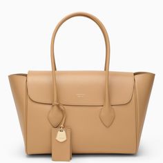 Large tote bag from Salvatore Ferragamo in camel-coloured grained calfskin featuring two top handles, a front flap with lettering logo, an internal flat zipped pocket, a gold-tone plaque charm and gold-tone metal hardware. Composition: 100% Leather Ferragamo Bag, Lettering Logo, Colored Leather, Camel Color, Large Tote Bag, Personalized Accessories, Medium Bags, Womens Tote, Large Tote