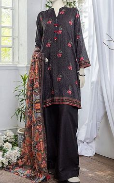 Junaid Jamshed Black Doria Suit | Pakistani Winter Dresses Black Embroidered Cotton Sets, Black Embroidered Long Sleeve Lawn Suit, Black Embroidered Long Sleeve Sets, Black Fitted Long Sleeve Lawn Suit, Unstitched Black Cotton Sets, Black Cotton Dress With Dupatta, Black Cotton Lawn Suit For Festive Occasions, Black Cotton Sets With Printed Motifs, Festive Black Cotton Lawn Suit