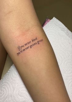 a woman's arm with a tattoo saying if you never had whatever graced