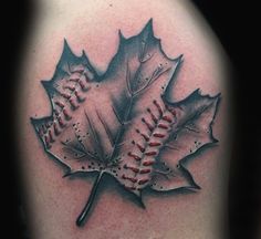 a baseball and leaf tattoo on the arm