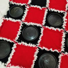 red and black checkerboard quilt with buttons on it's centerpieces