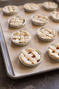 freshly baked pies on a baking sheet ready for the oven to be baked in