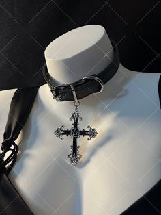 Embrace the edgy and punk vibe with our dark punk cross choker. This unique choker exudes a gothic and alternative aesthetic, perfect for expressing your individuality and subculture style. The choker features a striking cross pendant, adding a bold statement to your look.   Please note that this product includes one choker only. Affordable Metal Punk Choker, Edgy Choker For Alternative Fashion, Adjustable Gothic Choker For Cosplay, Gothic Choker For Concert, Gothic Choker For Halloween Concert, Edgy Black Choker For Alternative Fashion, Emo Choker For Alternative Fashion, Alternative Style Choker For Cosplay, Black Emo Choker For Concerts