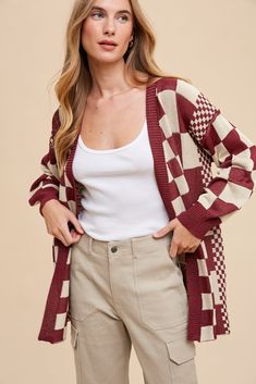 This Checked Out Cardigan is the perfect choice for fashionable and functional layering! Made from high quality and durable materials, it features a trendy check pattern with ribbed trim for extra style. This boyfriend fit cardigan is a must-have for any wardrobe. 83% Viscose 17% Nylon Ribbed Trim Finish Loose Fit Contrasting Grid sizes Exposed Seam Detail on Drop Shoulder Seam SIZE GUIDE & MEASUREMENTS: Model is 5'4", wears a size 3/5 and is modeling the small. More info here. Small 2-4 Medium 6-8 Large 10-12 X-Large 14-16 SIZE BUST SLEEVE LENGTH Small 47" 19" 29" Medium 51" 19" 29" Large 54" 20" 29" X-Large 56" 22" 29" **measurements may vary by 1/2" Ships from Utah within 1-3 business days of order being placed. Limited stock based on vendor availability. Fitted Cardigan, Boyfriend Fit, Check Pattern, Limited Stock, Burgundy Red, Drop Shoulder, Red Green, Utah, Size Guide