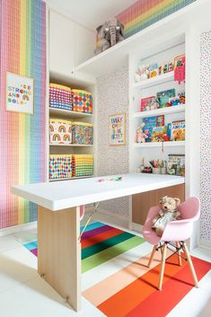 a child's playroom with colorful walls and flooring, including a desk