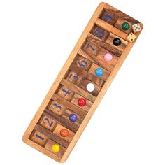 a wooden toy with different colored buttons on it's side and the bottom part of the board