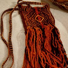 Chuspa Sami Indigenous Bag Pouch, The Inca Culture Old Textile Handmade 5" X 4" Inches Strap 17" Inches Plus Fringes 9'' Inches A Chuspas Is A Pouch That Is Used To Carry Coca And Cocoa Leaves, Used Primarily In The Andean Region Of South America. Both Textiles And Coca Are Very Important To The People In Andean South America. This Is A Handmade Piece Made By Indigenous From The Andes, The Colors Are Made From Native Plants And Roots The Colors Are Organic, Which Gives A Unique Touch Of Art. Every Sunday The Andeans Come From Different Towns Or Mountains Down To The Central Square To Sell Their Pieces Made During The Week. Handwoven Pouch Shoulder Bag, Bohemian Woven Pouch For Gift, Bohemian Handmade Travel Pouch, Artisan Handwoven Shoulder Bag As Gift, Artisan Woven Bag As Gift, Artisan Handwoven Shoulder Bag Gift, Artisan Weaving Bags For Gifts, Artisan Woven Bag As A Gift, Artisan Red Pouch Bag