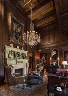 an ornate living room with chandelier and fireplace