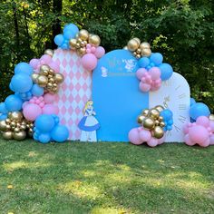 an outdoor area with balloons and decorations