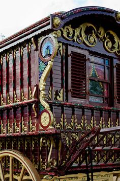 an elaborately decorated horse drawn carriage on display