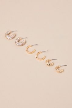 No matter what the occasion calls for, you'll be ready with the Lulus Stunning Collection Gold Rhinestone Hoop Earring Set! Shiny, gold-toned metal shapes this elevated collection of three sets of huggie-style hoop earrings. One pair has an undulating, organically-inspired design, while the second pair has a classic sleek and simple silhouette. The third pair of hoops are encrusted with dazzling rhinestones for a glittering finish to any look. Post backs. 0. 25" Diameter65% Zinc, 20% Steel, 15% Hoop Earring Set, Simple Silhouette, Hoop Earring Sets, Gold Rhinestone, Huggie Hoop Earrings, Accessories Jewelry Earrings, Gold Tone Metal, Wedding Accessories, Earring Set