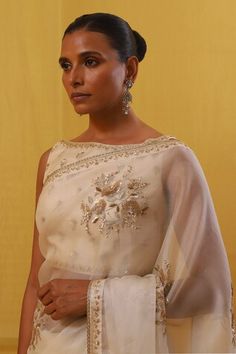 Off-white saree with sequin, gold zari, pearl, Swarovski crystal embroidery in scattered floral motifs. Paired with matching handwoven cotton tissue blouse. - Aza Fashions Off White Saree, Saree Gowns, Cotton Sarees Handloom, Organza Embroidery, Floral Saree, Knotted Blouse, White Saree, Lehenga Saree, Blouse For Women