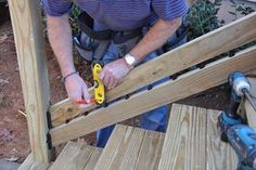 a man is working on some wood