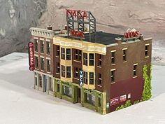 a model of a building with a sign on top