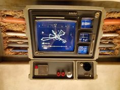 an old fashioned television sitting on top of a counter