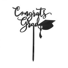 a cake topper that says congrats grad with a graduation cap on it