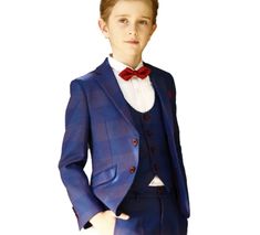 Nothing speaks classy other than the Navy Blue & Burgundy Classic Fit Suit. This elegant suit is the perfect suit for a young gentleman giving him the perfect tailored look for his next special event. COMES IN A 5-PIECE SET which includes a trouser, jacket, vest, shirt, and bow tie. You can have your kids wear them as a set or pair them with other clothes! WITH AN ELASTIC WAISTBAND this will give your kids enough space to move as the waist area is stretchable. CLASSICAL AND COMFORTABLE LOOK that Classic Royal Blue Tailored Tuxedo, Classic Royal Blue Three-piece Suit For Semi-formal Occasions, Classic Royal Blue Three-piece Suit For Semi-formal Events, Tailored Royal Blue Suits For Semi-formal Occasions, Classic Royal Blue Three-piece Suit For Formal Occasions, Royal Tailored Suits For Semi-formal Occasions, Tailored Royal Blue Party Sets, Tailored Royal Blue Semi-formal Suits, Royal Blue Single-breasted Suit For Semi-formal Occasions