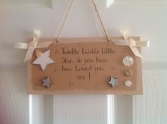 a sign hanging from the side of a door that says twinkle twinkle little star, do you know how loved you are?