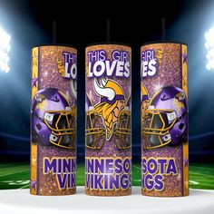 three can coolers with minnesota and minnesota football helmets on them in front of a stadium