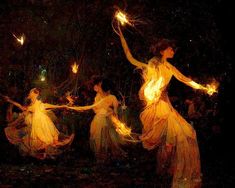 four women dressed in long dresses are holding fire wands as they fly through the air