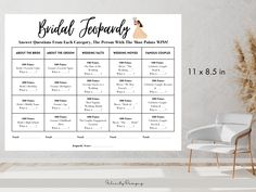 a wedding seating chart on a wall next to a chair