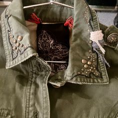 Lowered Price Until Friday @ 5pm Great Military Style Jacket, By Miss Me Heavily Beaded And Grommeted With Fleur Delise Metal Buttons Retailed For $155.00 Size Small Fully Lined Clothing Is New With Tags I Had Inventory Left Over After I Made The Decision To Not Renew Another 5 Year Lease At My Boutique. All Items Are Popular Name Brands Currently Selling At Stores Like Neiman Marcus And Nordstroms. Casual Cotton Embellished Outerwear, Embellished Cotton Outerwear For Fall, Long Sleeve Jean Jacket, Womens Utility Jacket, Military Jacket Green, Green Utility Jacket, Olive Green Jacket, Army Green Jacket, Studded Jacket