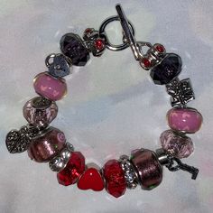 "Handmade Bracelet, Love, Valentine's Day, Hearts, Glass Beads, Charms, Crystal Beads.  Handmade by yours truly. Bracelet measures approximately 7\" long, diameter is 2.5\". Bracelet closure is the toggle type." Pink Beaded Bracelets With Charms For Valentine's Day, Handmade Charm Bracelet With Round Beads For Valentine's Day, Heart-shaped Charms Beaded Bracelets For Jewelry Making, Valentine's Day Gift Crystal Bracelet With Heart Beads, Colorful Beads Heart Bracelet For Valentine's Day, Heart Beads For Valentine's Day Gift, Valentine's Day Heart Bracelet With Colorful Beads, Pink Beaded Charms Bracelets For Valentine's Day, Valentine's Day Beaded Friendship Charm Bracelet