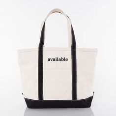 Our classic Canvas Boat Tote in medium is a staple for any tote-bag lover. Features a top zip enclosure, self-constructed canvas handle in contrasting trim color, internal pocket organizer with zippered enclosure and a spacious interior with a flat bottom.  The text and trim color is as shown only. Care instructions- In order to make the most of the extended use of this product, the manufacturer strongly encourages customers to prep the canvas, jute, and cotton-linen blend products by spraying t Large Capacity Bucket Canvas Bag, Classic Black Rectangular Canvas Bag, Canvas Bags With Reinforced Double Handles, Duck Canvas Tote Bag With Canvas Lining, Black Canvas Bags With Canvas Lining, Black Canvas Bag With Canvas Lining, Practical Duck Canvas Bags For Everyday Use, Rectangular Canvas Shoulder Bag With Reinforced Handles, Daily Use Canvas Tote Bag With Zipper Closure