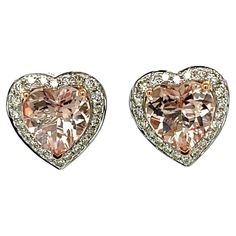 These adorable Heart shaped Morganite stud earrings have a halo of shimmering diamonds around them. The center stone has three prong setting in Rose gold for the perfect accent. There is a double push lock closure for extra security. These earrings come in a beautiful box ready for the perfect gift! 14KW: 3.75 gms Morganite wt: 4.56 cts, heart shape Diam wt: 0.63 cts Diam stones: 116 round, brilliant cut, Color: I, Clarity SI Free shipping within the US! Ships within 1-2 business days Retail val Rose Gold Heart Cut Diamond Earrings, Luxury Heart-shaped Earrings With Prong Setting, Luxury Heart-shaped Diamond Cut Earrings, Heart-shaped Rose Gold Earrings With Diamond Accents, Pink Heart-shaped Diamond Cut Jewelry, Morganite Earrings, Pink Heart Earrings, Morganite Diamond, Rose Gold Heart