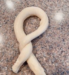 a long piece of bread sitting on top of a counter