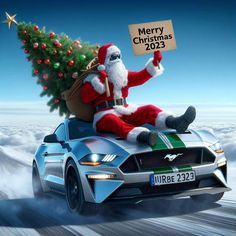 a santa clause sitting on top of a car holding a sign