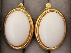 1x.75 inch oval gold tone with a white cabochon clip on earrings slight tarnishing on the back unsigned This is a vintage item and may have some signs of wear.  I will do my best to describe any issues If you are unhappy with your purchase, please let me know and I will do my best to fix it. Luxury Clip-on Oval Cabochon Earrings, Luxury Oval Cabochon Clip-on Earrings, Bellingham Wa, Oval Earrings, Oval Earring, Fix It, Clip On, Clip On Earrings, Gold Tones